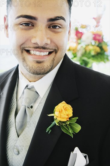 Hispanic man wearing tuxedo