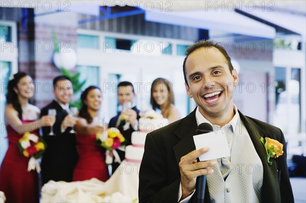 Russian man giving toast at wedding