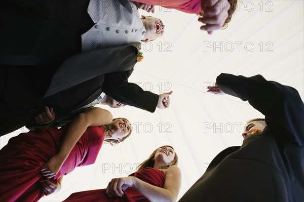 Low angle view of multi-ethnic bridal party