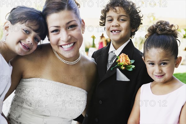 Bride and children hugging