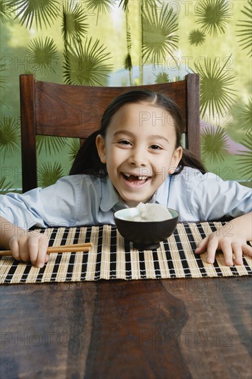 Asian girl with bowl of rice