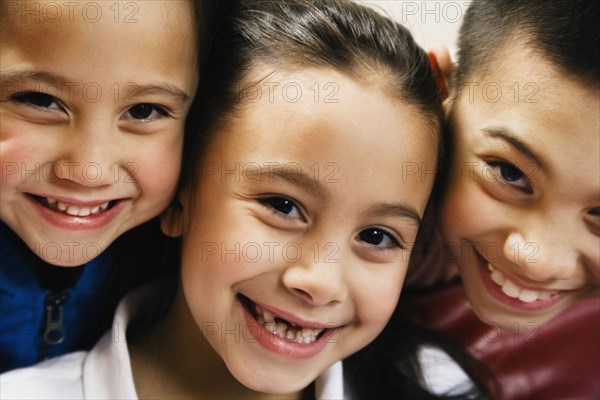 Close up of Asian siblings smiling