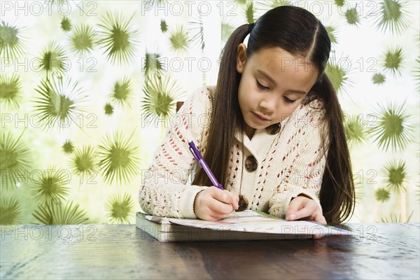 Asian girl doing homework