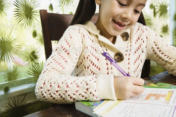 Asian girl doing homework