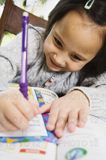 Asian girl doing homework