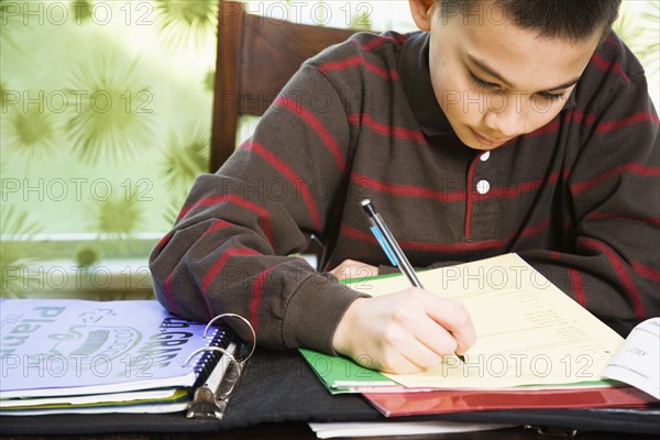 Asian boy doing homework