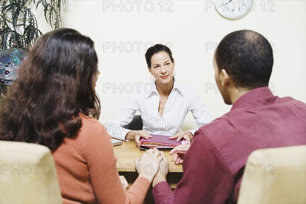 Mixed Race businesswoman talking to clients