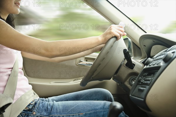 Asian teenager driving car