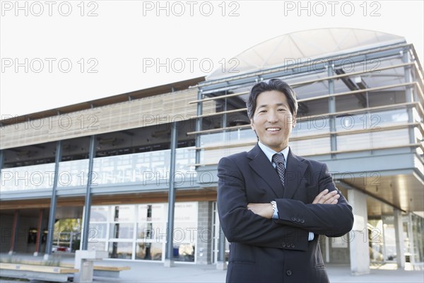 Portrait of Asian businessman with arms crossed