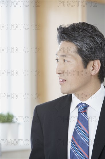 Asian businessman looking to side