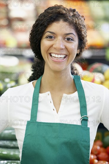 Mixed Race clerk in grocery store