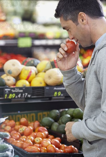 Hispanic man shopping for produce