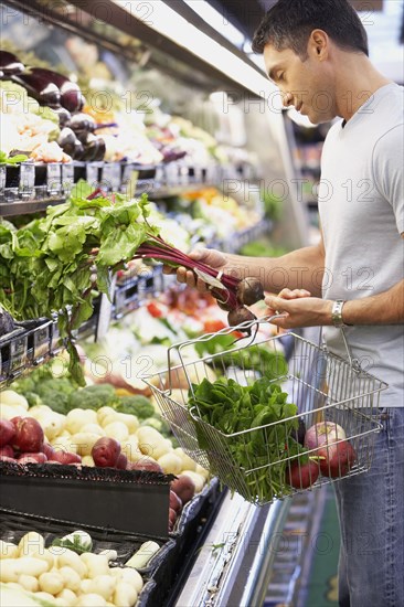 Hispanic man shopping for produce