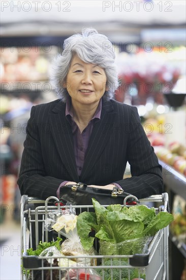 Senior Asian woman in grocery store