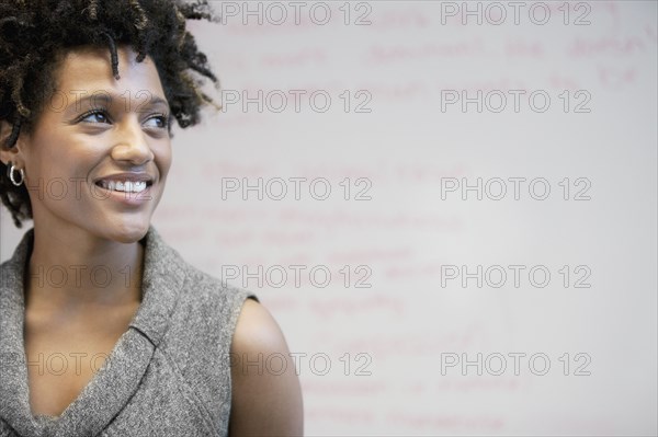 Smiling mixed race businesswoman