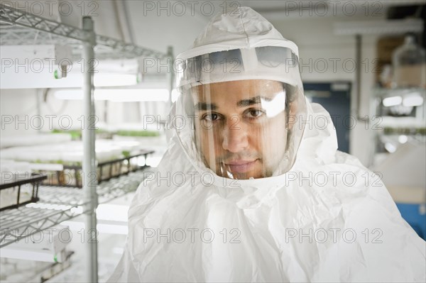 Middle Eastern scientist in clean suit in laboratory