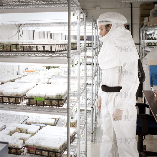 Middle Eastern scientist in clean suit in laboratory