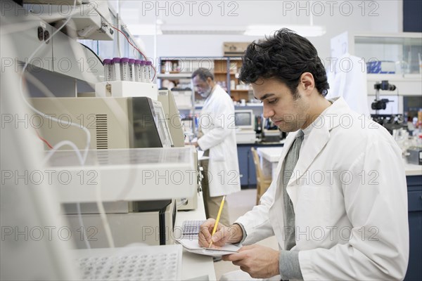 Middle Eastern scientist working in laboratory