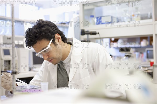 Middle Eastern scientist working in laboratory