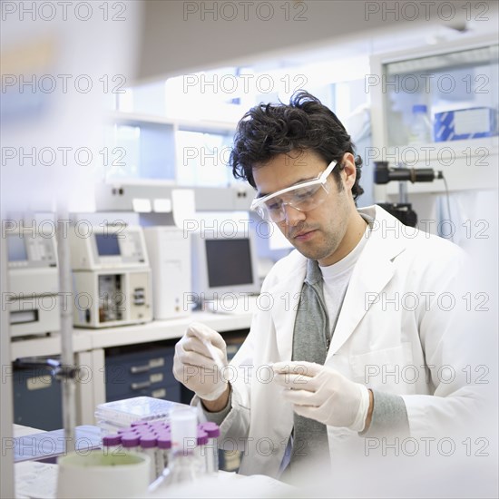 Middle Eastern scientist working in laboratory