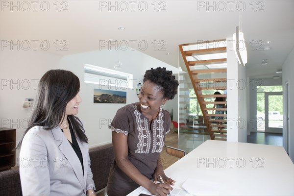 Real estate agent talking to prospective buyer