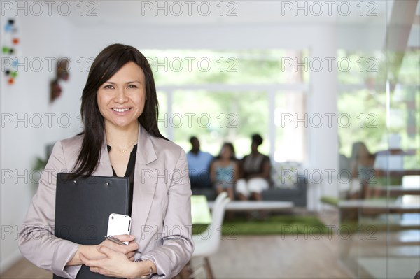 Real estate agent showing family new home