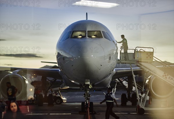 Airplane parked in gate at airport