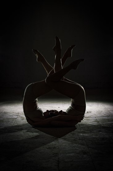 Silhouette of dancers posing in studio