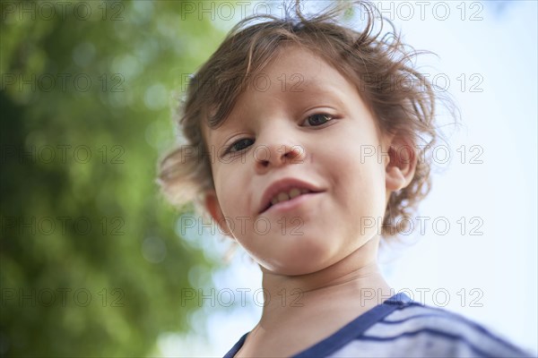 Hispanic boy looking down