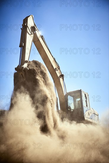 Dust from digger digging dirt