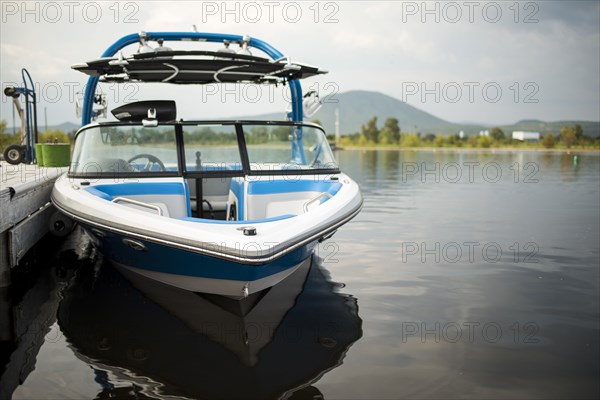 Boat at dock in river