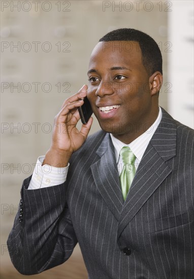 African businessman talking on cell phone