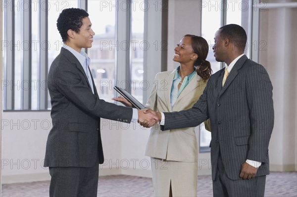 Multi-ethnic business people handshaking