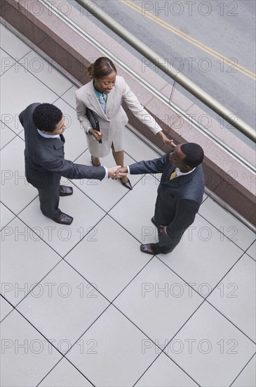 Multi-ethnic business people shaking hands