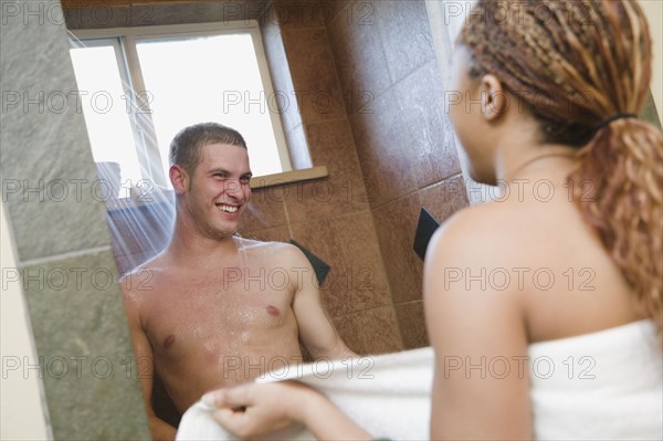 Multi-ethnic couple showering