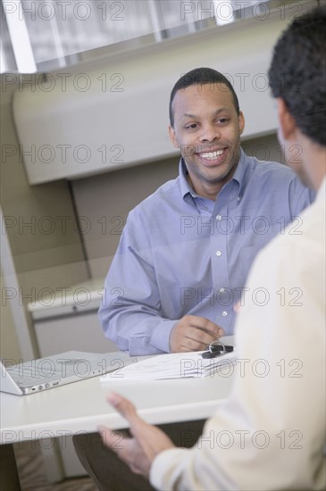 Two businessmen working in office