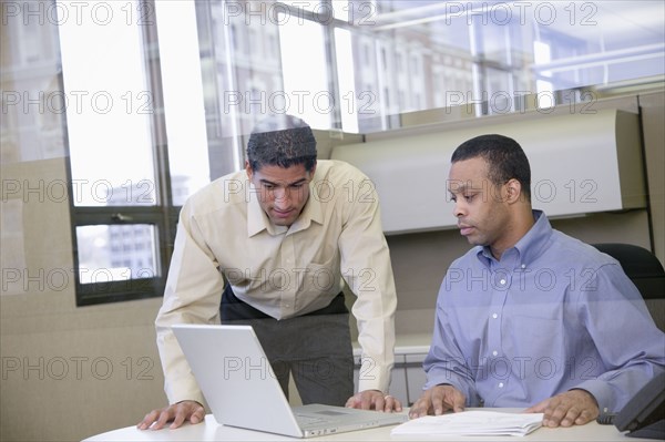 Two businessmen working in office