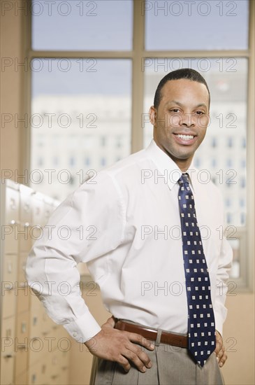 African businessman in file room