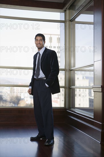 Businessman smiling in corridor