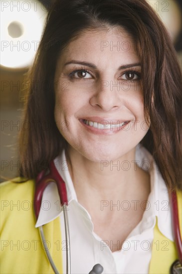 Confident mixed race doctor smiling