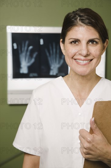 Doctor with medical chart and x-rays