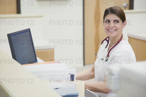 Nurse working at nurse's station