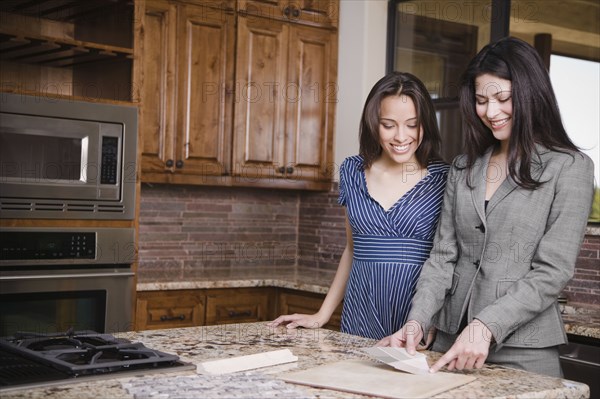 Hispanic woman working with interior designer