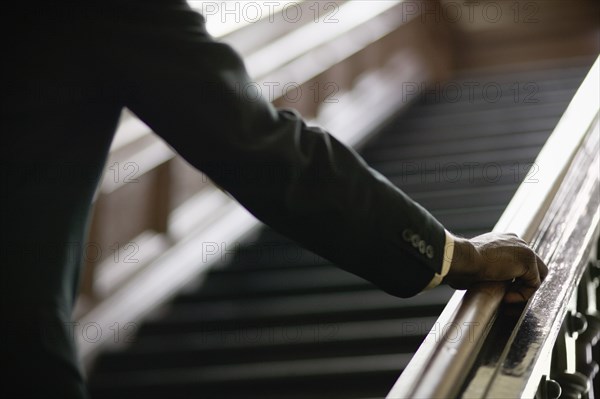 African businessman ascending staircase