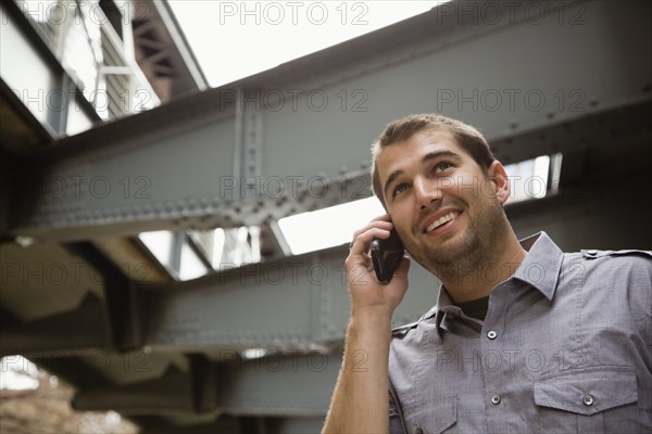 Hispanic man talking on cell phone