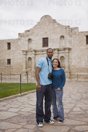 Smiling couple at tourist attraction