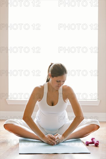 Pregnant woman practicing yoga