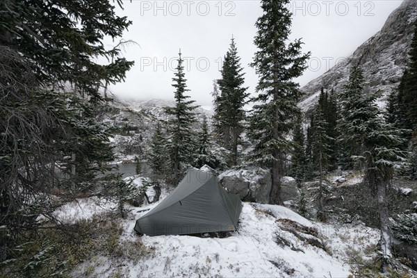 Camping tent in snowy landscape