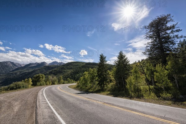 Curving two-lane road near mountains