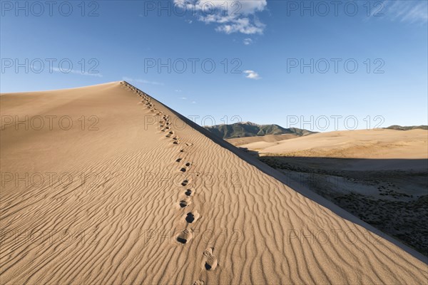 Footprints in sand dune